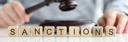 International sanctions and judge with gavel in courtroomの写真素材