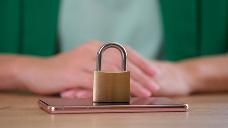 Closed metal lock on modern smartphone, mobile phone securityの写真素材