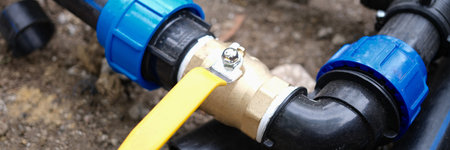 Water pipe connector with faucet closeup for watering plants in garden