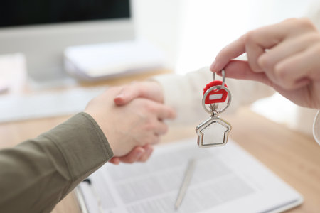The handshake real estate agent with a client, key transferの写真素材