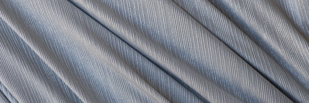 Closeup of gray synthetic fabric with folds