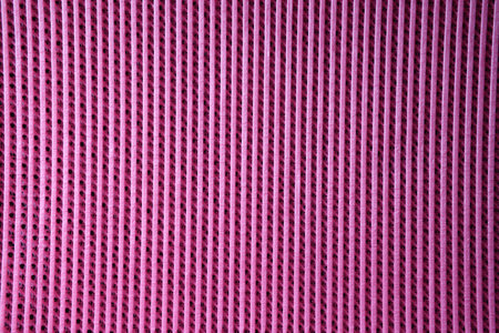 Textured pink cotton fabric sample surface as backgroundの写真素材