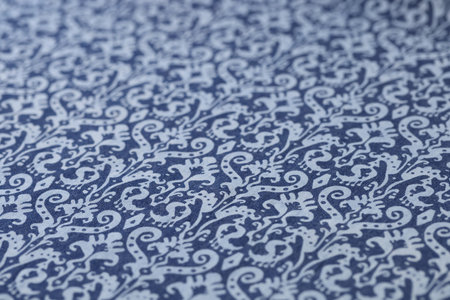 Blue soft fabric with white pattern designed for bed linenの写真素材