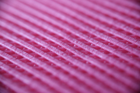 Textured striped fuccia pink fabric sheet as backgroundの写真素材