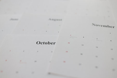 Calendar pages with autumn months names as background
