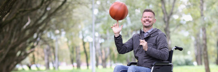Happy smiling disabled man twirling basketball ball