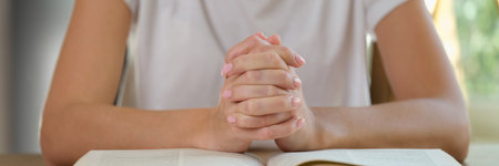 Female hands in lock on big bookの写真素材