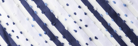 White fabric with blue stripes and wooly dots