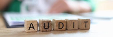 Audit word collected with wooden cubes in rowの写真素材