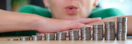 Hopeful business woman thinks how to increase earnings and profits.の写真素材