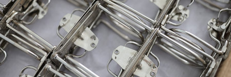 Bound metal parts for fastening the folder, close-up