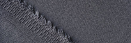 Face and back side of gray fabric as background.