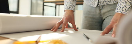 A woman in the office on the table is an empty hatman