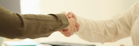 Female handshake in the office, hands close-up