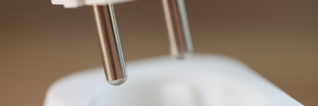 Plugging or unplugging electric plug into socket.の写真素材