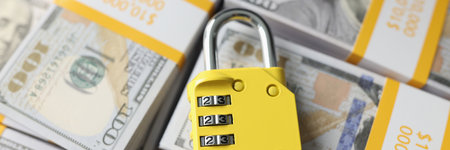 Padlock with combination on background of dollar banknotes.