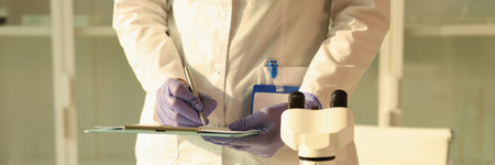 Woman in uniform makes notes after doing urine sample test