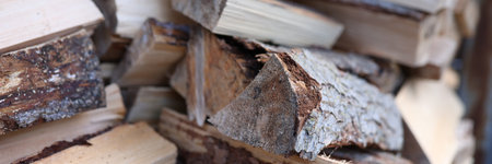 Stack of chopped wood logs for bonfire