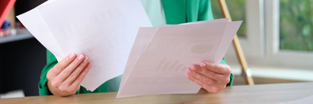 Woman working with financial documents in officeの写真素材