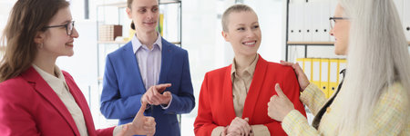 Boss and colleagues applaud to greet employee achievementの写真素材