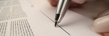 Businesswoman prepares to sign contract showing agreementの写真素材