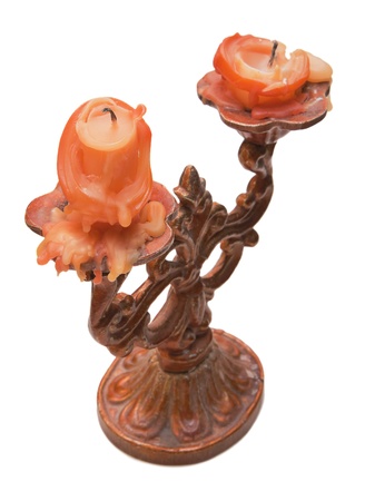 Old candelabrum with two candle-ends isolated on whiteの写真素材