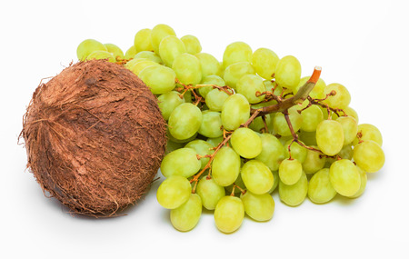 Bunch of green grapes and coconut isolated on white backgroundの写真素材
