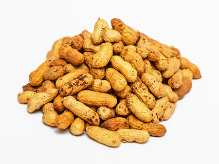 Pile of dried peanuts on white backgroundの写真素材
