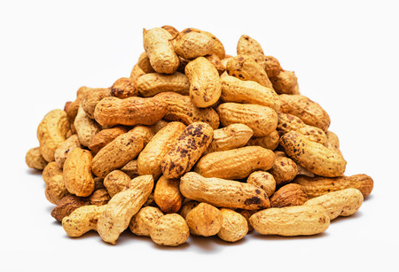 Pile of dried peanuts on white backgroundの写真素材