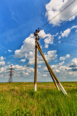 Powerline against a background of the cloudy skyの写真素材
