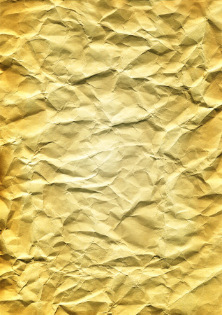 Grunge crumpled paper texture in light yellow tonesの写真素材