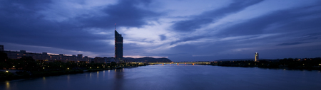 View over the Danube and the Millenium Tower at Vienna at sunsetの写真素材