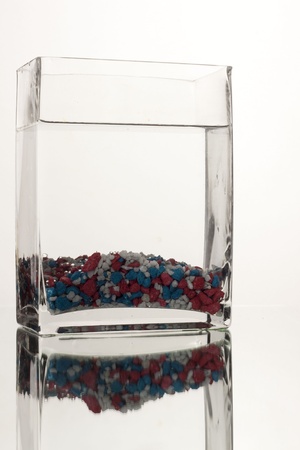 Glass with colored stones の写真素材