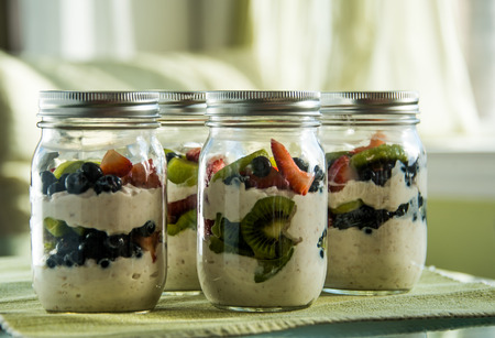 Fruit and Yogurt parfaits in sunny kitchの写真素材