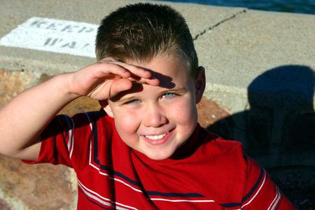 this is an image of my son, keeping the hot desert sun out of his blue eyes.の写真素材
