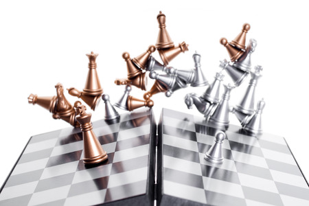 A pawn and a king on a chessboard. business conceptの写真素材
