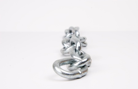 Metallic chain on white background