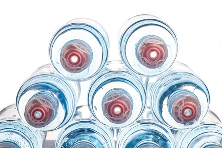 Plastic bottle of drinking water isolated on white