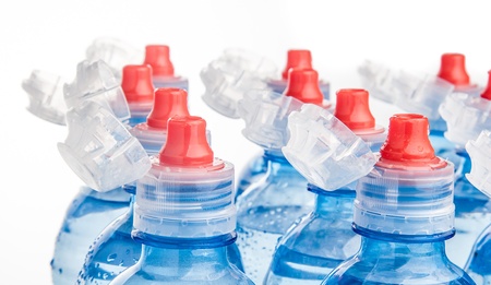 Plastic bottle of drinking water isolated on white