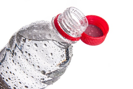 Plastic bottle of drinking water isolated on whiteの写真素材