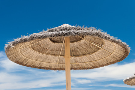 Sunshade Umbrellas on the beach at summer dayの写真素材