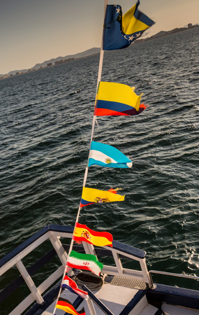 Some national flags fluttering on the rope on deck