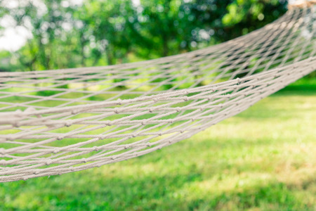 White hammock among the trees at summer dayの写真素材