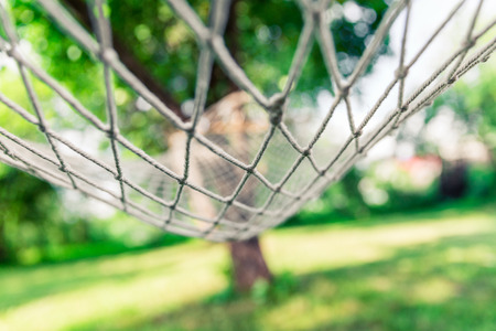 White hammock among the trees at summer dayの写真素材