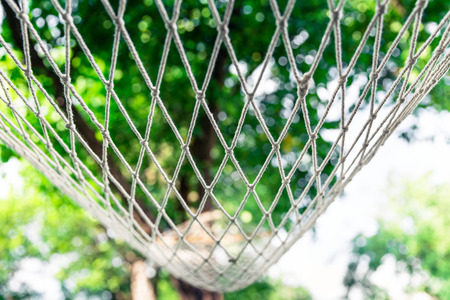 White hammock among the trees at summer dayの写真素材