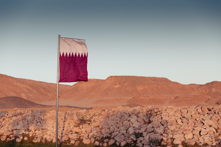 Waving National flag of Qatar on flagpole
