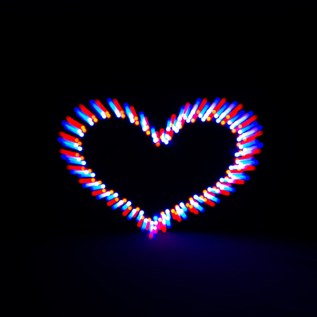 Glowing heart on dark background