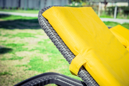 Yellow sun loungers on the lawn