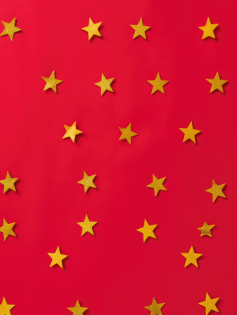 Creative layout made of yellow stars on red background. Minimal concept.の素材