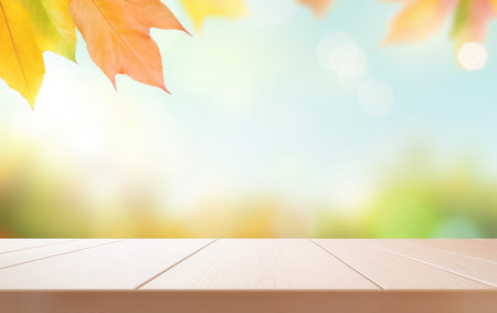 Wooden table and blurred Autumn background. Autumn yellow leaves bannerの素材